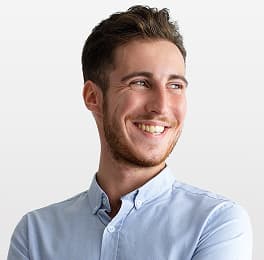 Frontend developer coding on a laptop